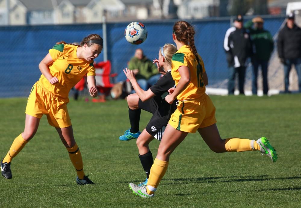 GVL / Kevin Sielaff - Kendra Stauffer (5) settles a header from Northern's defense.  Grand Valley's women's soccer team squares off against Northern Michigan Oct. 18 and wins with a final score of 7-0.