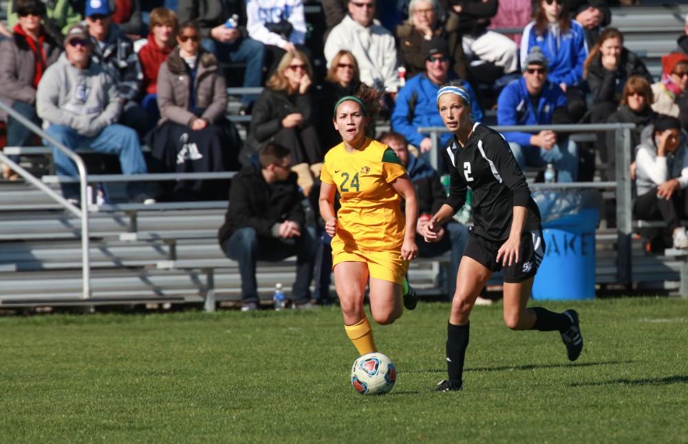 GVL / Kevin Sielaff - Katie Klunder (2) races down field with the ball.  Grand Valley's women's soccer team squares off against Northern Michigan Oct. 18 and wins with a final score of 7-0.