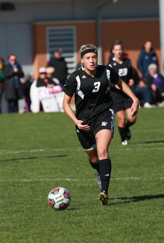 GVL / Kevin Sielaff - Gabbie Guibord (3) looks to pass the ball.  Grand Valley's women's soccer team squares off against Northern Michigan Oct. 18 and wins with a final score of 7-0.