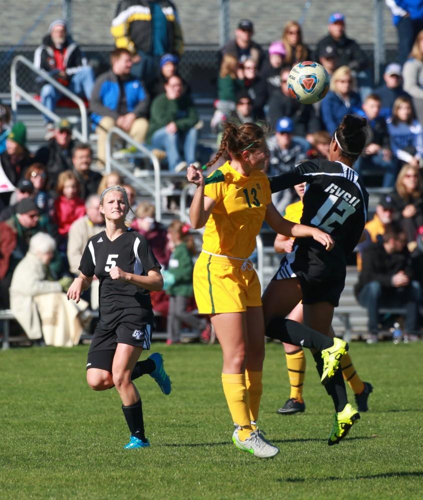 GVL / Kevin Sielaff - Jayma Martin (12) goes up for a header.  Grand Valley's women's soccer team squares off against Northern Michigan Oct. 18 and wins with a final score of 7-0.