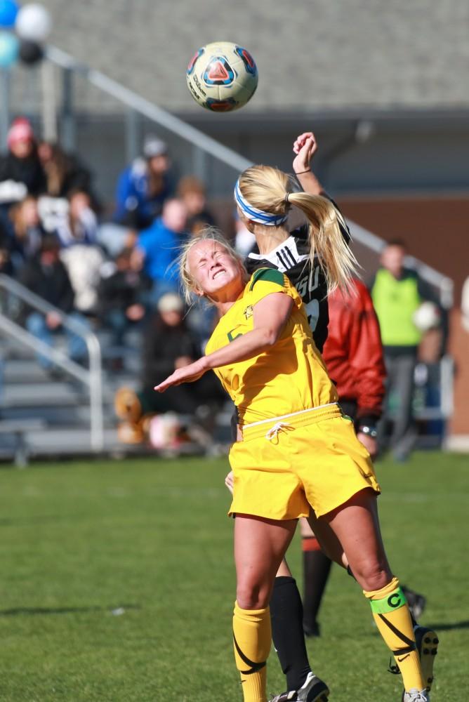 GVL / Kevin Sielaff - Katie Klunder (2) fights for field position with Northern's defense.  Grand Valley's women's soccer team squares off against Northern Michigan Oct. 18 and wins with a final score of 7-0.