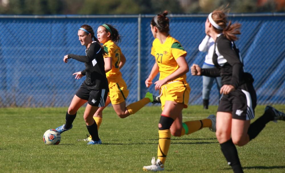 GVL / Kevin Sielaff - Clare Carlson (7) looks to cross the ball.  Grand Valley's women's soccer team squares off against Northern Michigan Oct. 18 and wins with a final score of 7-0.