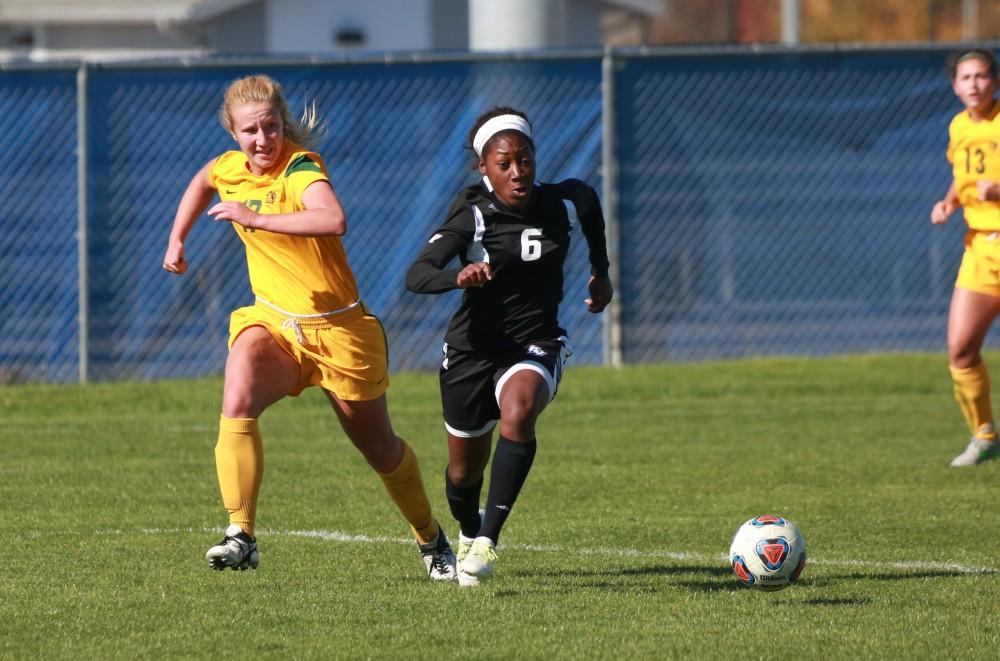 GVL / Kevin Sielaff - Katie Bounds (6) takes control of the ball in Northern's zone and gets a shot off.  Grand Valley's women's soccer team squares off against Northern Michigan Oct. 18 and wins with a final score of 7-0.