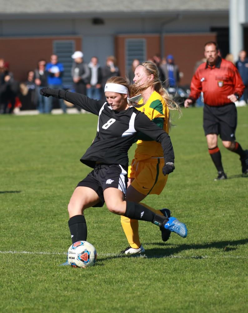 GVL / Kevin Sielaff - Tara Lierman (8) strikes the ball.  Grand Valley's women's soccer team squares off against Northern Michigan Oct. 18 and wins with a final score of 7-0.