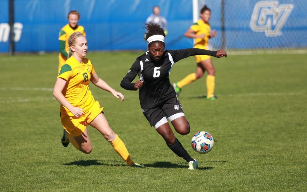 GVL / Kevin Sielaff - Katie Bounds (6) races toward the net and fires a shot.  Grand Valley's women's soccer team squares off against Northern Michigan Oct. 18 and wins with a final score of 7-0.