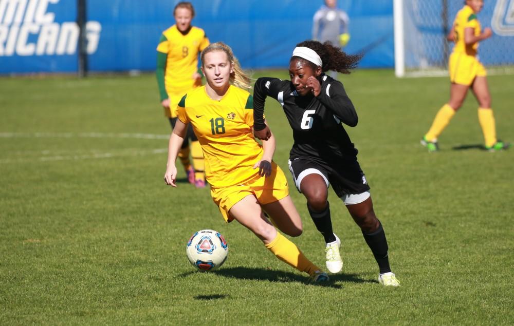 GVL / Kevin Sielaff - Katie Bounds (6) races toward the net and fires a shot.  Grand Valley's women's soccer team squares off against Northern Michigan Oct. 18 and wins with a final score of 7-0.