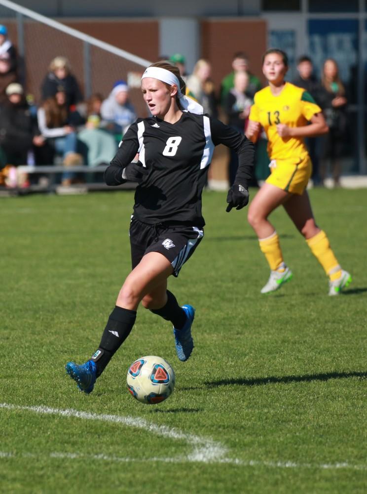 GVL / Kevin Sielaff - Tara Lierman (8) tries to catch up to the ball before Northern's defense sends it back down field.  Grand Valley's women's soccer team squares off against Northern Michigan Oct. 18 and wins with a final score of 7-0.