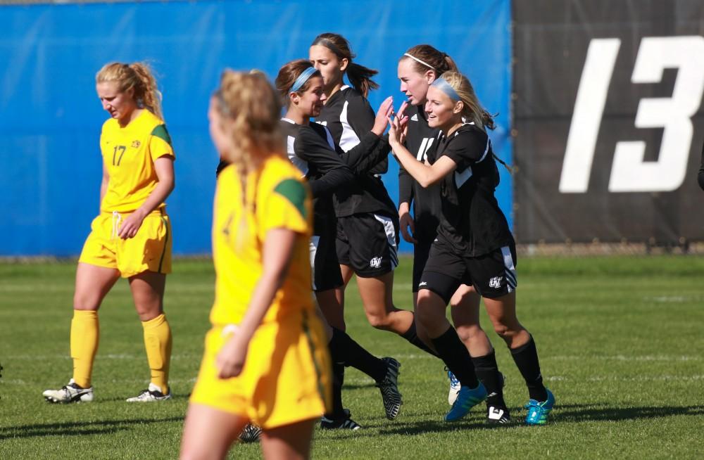 GVL / Kevin Sielaff -  Kendra Stauffer (5) celebrates a four goal game.  Grand Valley's women's soccer team squares off against Northern Michigan Oct. 18 and wins with a final score of 7-0.