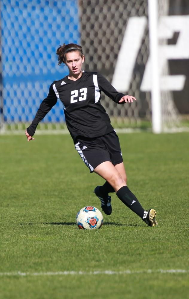 GVL / Kevin Sielaff - Katy Woolley (23) dances with the ball in Grand Valley's zone.  Grand Valley's women's soccer team squares off against Northern Michigan Oct. 18 and wins with a final score of 7-0.