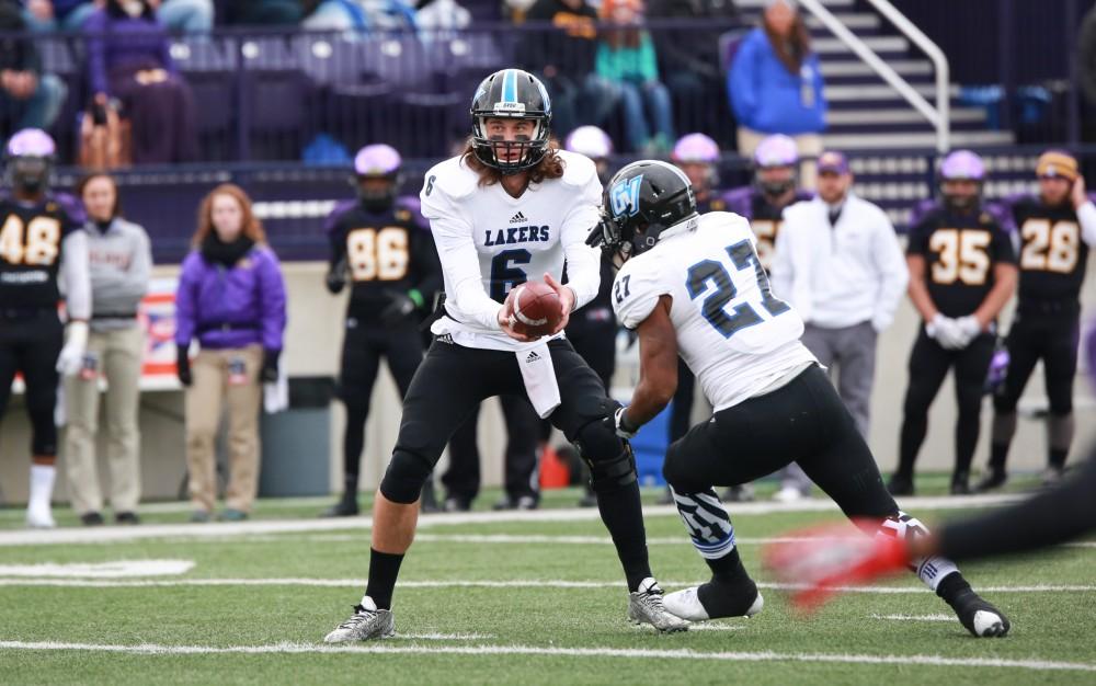 GVL / Kevin Sielaff - Bart Williams (6) hands the ball off to Kirk Spencer (27).  Grand Valley defeats Ashland with a final score of 45-28 Nov. 22 at Ashland University.