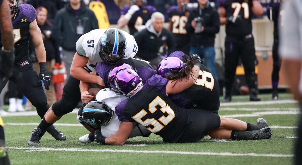 GVL / Kevin Sielaff - Brandon Revenberg (57) makes the tackle on an Eagle offensive drive.  Grand Valley defeats Ashland with a final score of 45-28 Nov. 22 at Ashland University.