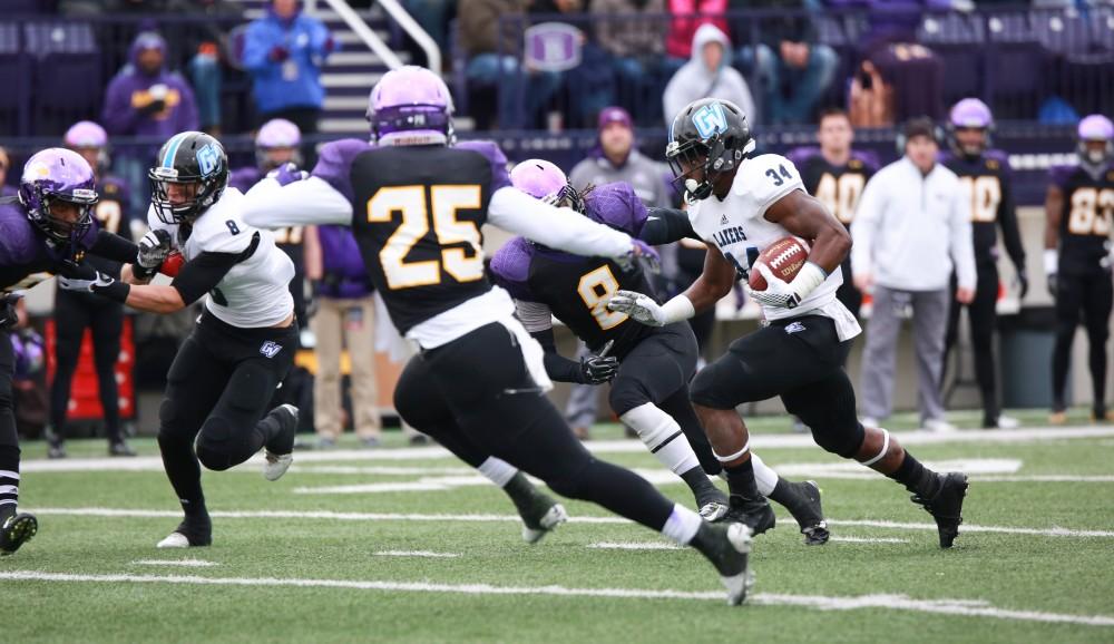 GVL / Kevin Sielaff - Marty Carter (34) runs the ball through Ashland's defense.  Grand Valley defeats Ashland with a final score of 45-28 Nov. 22 at Ashland University.