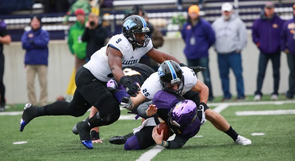 GVL / Kevin Sielaff - Garrett Pougnet (25) and Matt Judon (9) bring down Ashland's quarterback.  Grand Valley defeats Ashland with a final score of 45-28 Nov. 22 at Ashland University.