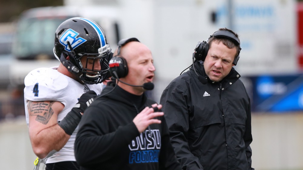 GVL / Kevin Sielaff - Alton Voss (4), injured on a play, is assisted to the sideline by head coach Matt Mitchell.  Grand Valley defeats Ashland with a final score of 45-28 Nov. 22 at Ashland University.