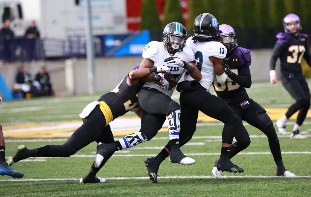 GVL / Kevin Sielaff -  Kirk Spencer (27) receives the ball bounds toward the end zone.  Grand Valley defeats Ashland with a final score of 45-28 Nov. 22 at Ashland University.