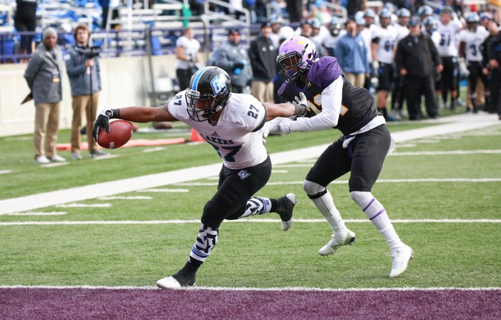 GVL / Kevin Sielaff -  Kirk Spencer (27) breaks a tackle and scores a touchdown.  Grand Valley defeats Ashland with a final score of 45-28 Nov. 22 at Ashland University.