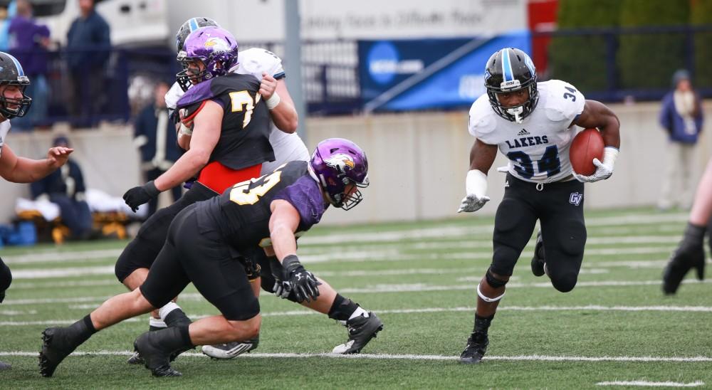 GVL / Kevin Sielaff -  Marty Carter (34) rushes the ball to the 35 yard line.  Grand Valley defeats Ashland with a final score of 45-28 Nov. 22 at Ashland University.