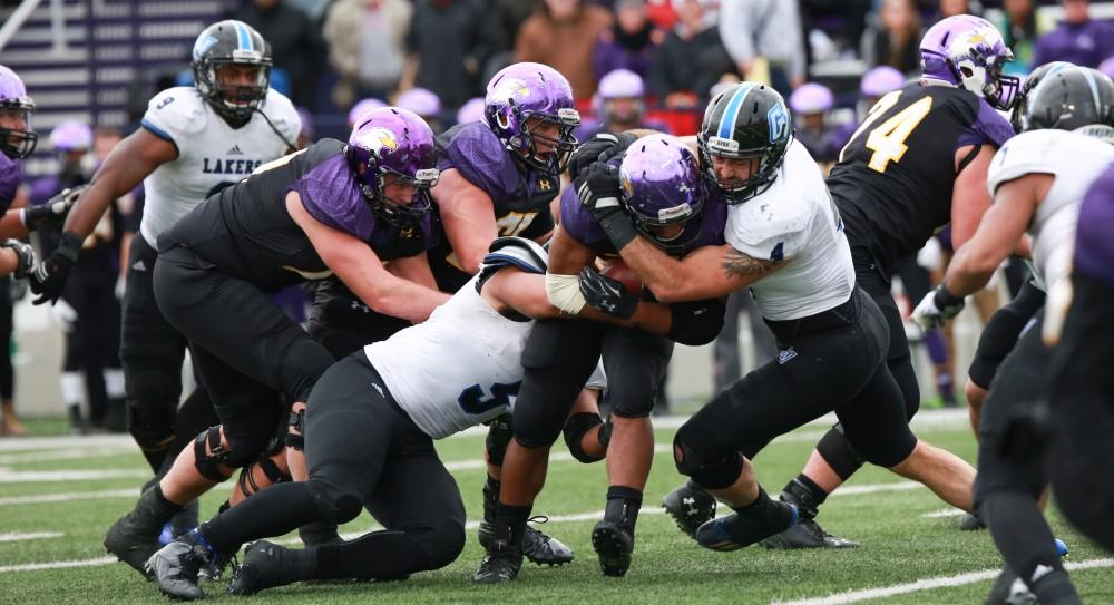 GVL / Kevin Sielaff -  Alton Voss (4) brings down an Ashland offensive attack.  Grand Valley defeats Ashland with a final score of 45-28 Nov. 22 at Ashland University.