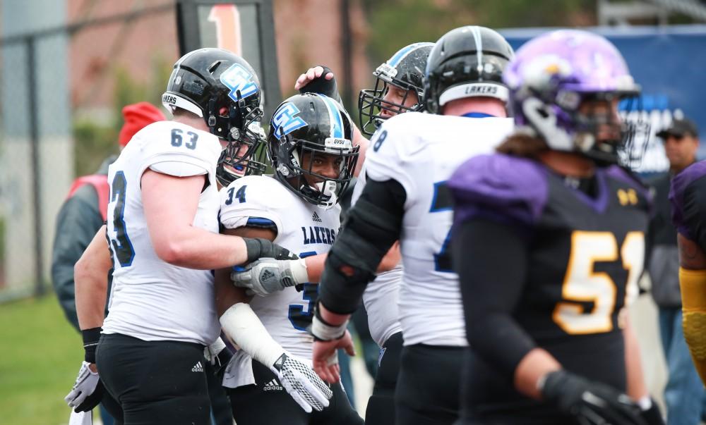 GVL / Kevin Sielaff - Marty Carter (34) celebrates after having scored a touchdown.  Grand Valley defeats Ashland with a final score of 45-28 Nov. 22 at Ashland University.