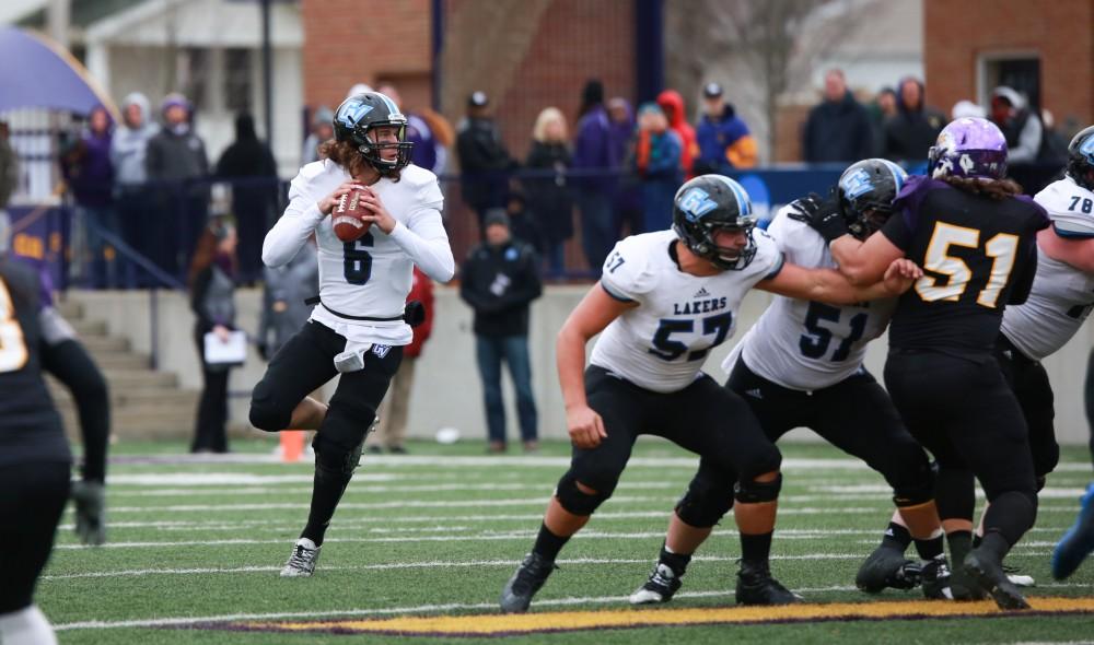 GVL / Kevin Sielaff - Bart Williams (6) steps back in the pocket and prepares to throw a pass toward the end zone.  Grand Valley defeats Ashland with a final score of 45-28 Nov. 22 at Ashland University.