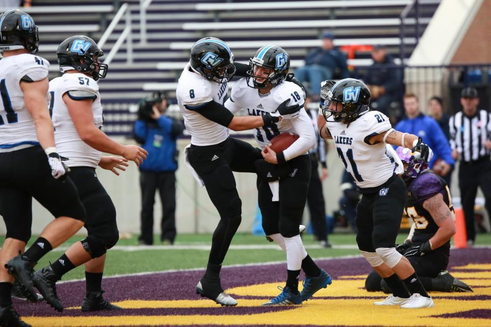 GVL / Kevin Sielaff -  Ollie Ajami (18) and company celebrate his touchdown.  Grand Valley defeats Ashland with a final score of 45-28 Nov. 22 at Ashland University.