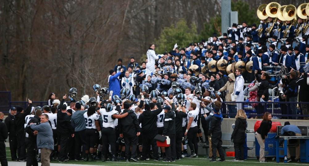 GVL / Kevin Sielaff -  Grand Valley's marching band and the Laker football squad gather at the end of the match to sing to the fight song together.  Grand Valley defeats Ashland with a final score of 45-28 Nov. 22 at Ashland University.