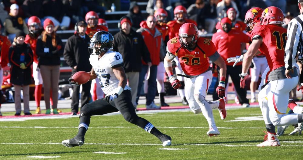 GVL / Kevin Sielaff - Kirk Spencer (27) spins to evade a tackle and advances down field.  Grand Valley defeats Ferris with a final score of 38-34 at Top Taggart Field Nov. 28 in Big Rapids, MI.