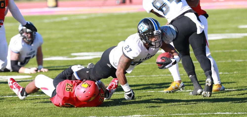 GVL / Kevin Sielaff - Kirk Spencer (27) is taken down near mid field.  Grand Valley defeats Ferris with a final score of 38-34 at Top Taggart Field Nov. 28 in Big Rapids, MI.