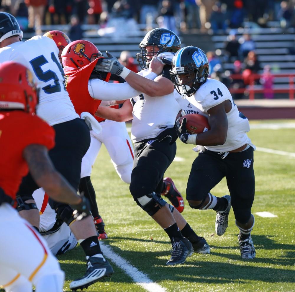 GVL / Kevin Sielaff - Marty Carter (34) looks for a hole in Ferris' defense.  Grand Valley defeats Ferris with a final score of 38-34 at Top Taggart Field Nov. 28 in Big Rapids, MI.