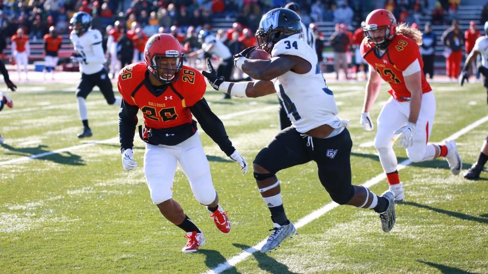 GVL / Kevin Sielaff - Marty Carter (34) leaps and bounds to evade tackles.  Grand Valley defeats Ferris with a final score of 38-34 at Top Taggart Field Nov. 28 in Big Rapids, MI.