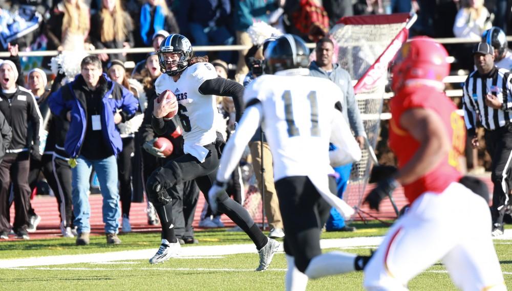 GVL / Kevin Sielaff - Bart Williams (6) receives the ball from Marty Carter (34) and runs toward the end zone.  Grand Valley defeats Ferris with a final score of 38-34 at Top Taggart Field Nov. 28 in Big Rapids, MI.