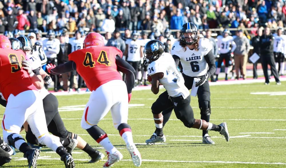 GVL / Kevin Sielaff - Marty Carter (34) takes the hand-off and makes a run toward the end zone.  Grand Valley defeats Ferris with a final score of 38-34 at Top Taggart Field Nov. 28 in Big Rapids, MI.