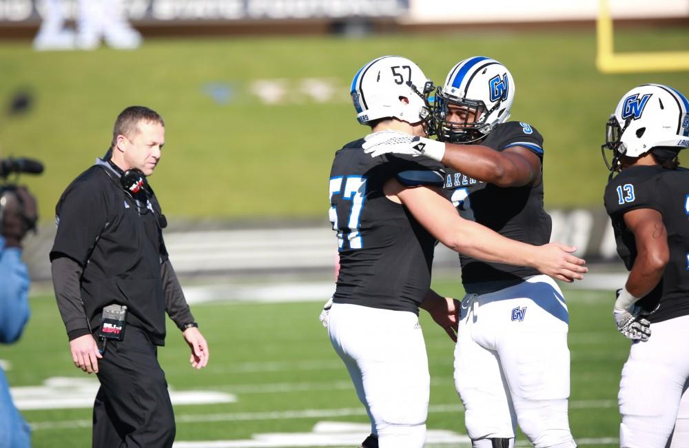 GVL / Kevin Sielaff - The Lakers celebrate their seniors before the match.  Grand Valley squares off against SVSU Nov. 14 in Allendale. The Lakers hold on and win with a final score of 24-17.