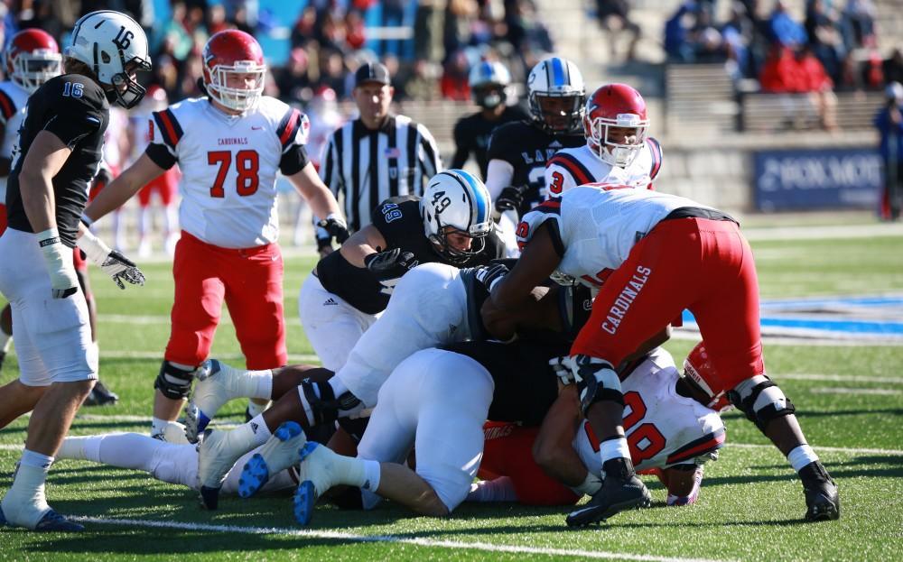 GVL / Kevin Sielaff - Collin Schlosser (49) brings down a run by SVSU.   Grand Valley squares off against SVSU Nov. 14 in Allendale. The Lakers hold on and win with a final score of 24-17.