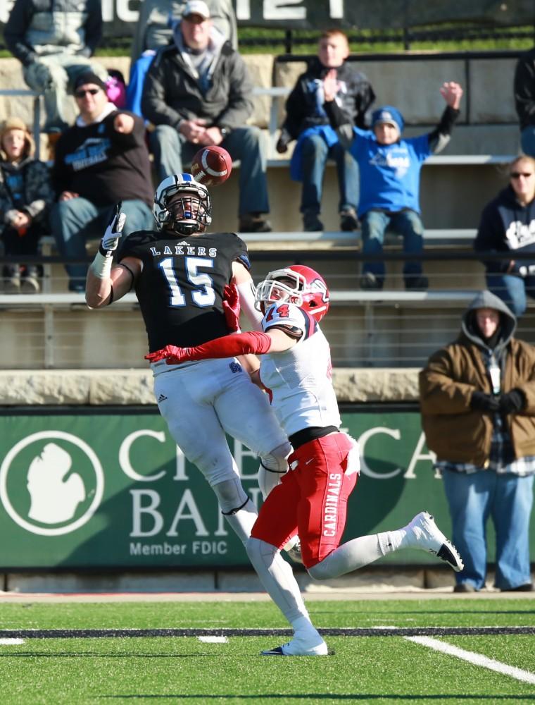 GVL / Kevin Sielaff - Jamie Potts (15) catches a pass that leads to the first Laker touchdown.  Grand Valley squares off against SVSU Nov. 14 in Allendale. The Lakers hold on and win with a final score of 24-17.