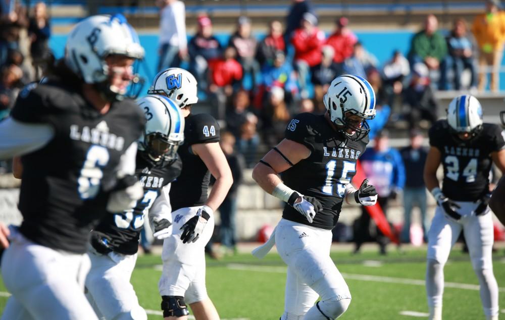 GVL / Kevin Sielaff - Jamie Potts (15) returns to the Lakers'  bench.  Grand Valley squares off against SVSU Nov. 14 in Allendale. The Lakers hold on and win with a final score of 24-17.