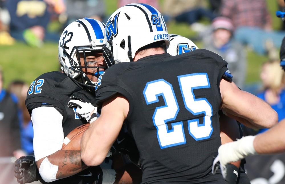 GVL / Kevin Sielaff - Donte Carey (32) intercepts an SVSU pass and returns posession to Grand Valley.  Grand Valley squares off against SVSU Nov. 14 in Allendale. The Lakers hold on and win with a final score of 24-17.