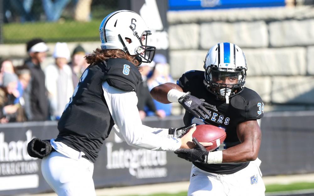 GVL / Kevin Sielaff - Marty Carter (34) prepares to run with the ball.  Grand Valley squares off against SVSU Nov. 14 in Allendale. The Lakers hold on and win with a final score of 24-17.