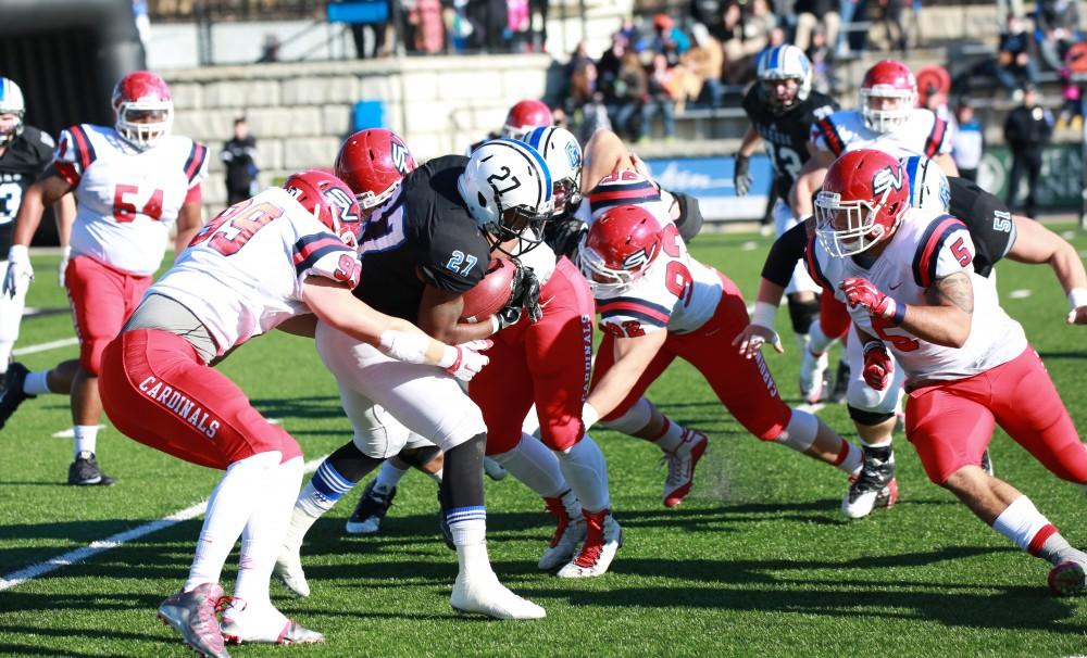 GVL / Kevin Sielaff - Kirk Spencer (27) carries the ball up field.  Grand Valley squares off against SVSU Nov. 14 in Allendale. The Lakers hold on and win with a final score of 24-17.