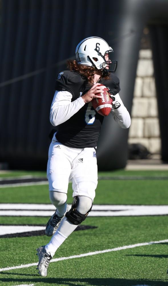 GVL / Kevin Sielaff - Bart Williams (6) steps back and prepares to throw the ball.  Grand Valley squares off against SVSU Nov. 14 in Allendale. The Lakers hold on and win with a final score of 24-17.