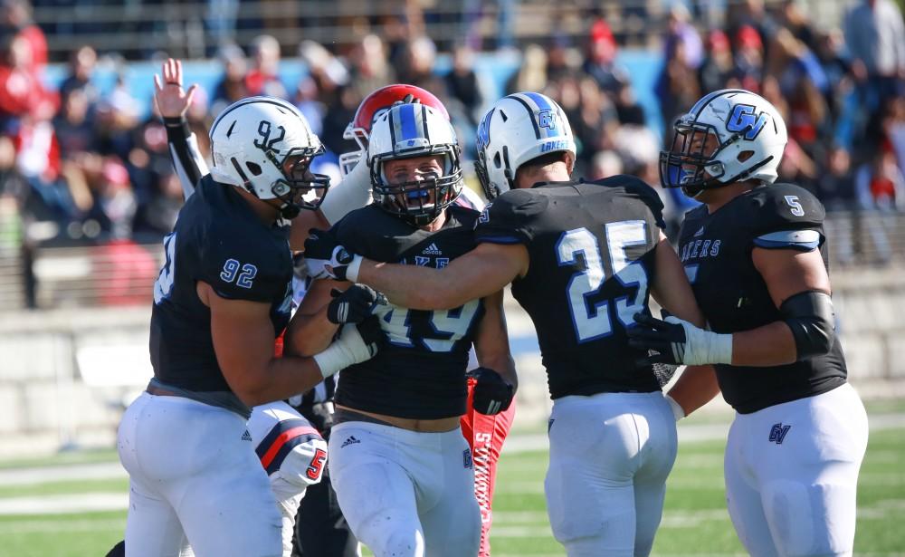 GVL / Kevin Sielaff - Collin Schlosser (49) celebrates a tackle.  Grand Valley squares off against SVSU Nov. 14 in Allendale. The Lakers hold on and win with a final score of 24-17.