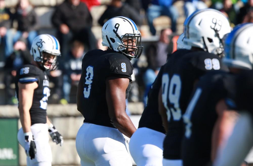 GVL / Kevin Sielaff - Matt Judon (9) prepares to make a run at SVSU's QB.  Grand Valley squares off against SVSU Nov. 14 in Allendale. The Lakers hold on and win with a final score of 24-17.