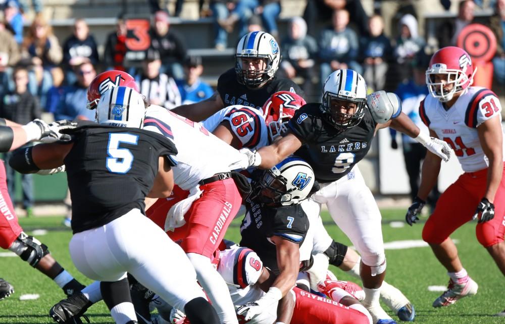 GVL / Kevin Sielaff - Matt Judon (9) gets a hand on SVSU's QB before he is tackled to the ground.  Grand Valley squares off against SVSU Nov. 14 in Allendale. The Lakers hold on and win with a final score of 24-17.