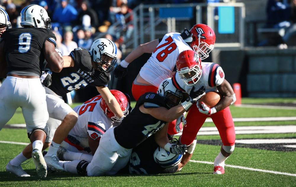 GVL / Kevin Sielaff -  Jermaih Johnson (6) of SVSU carries the ball up field.  Grand Valley squares off against SVSU Nov. 14 in Allendale. The Lakers hold on and win with a final score of 24-17.