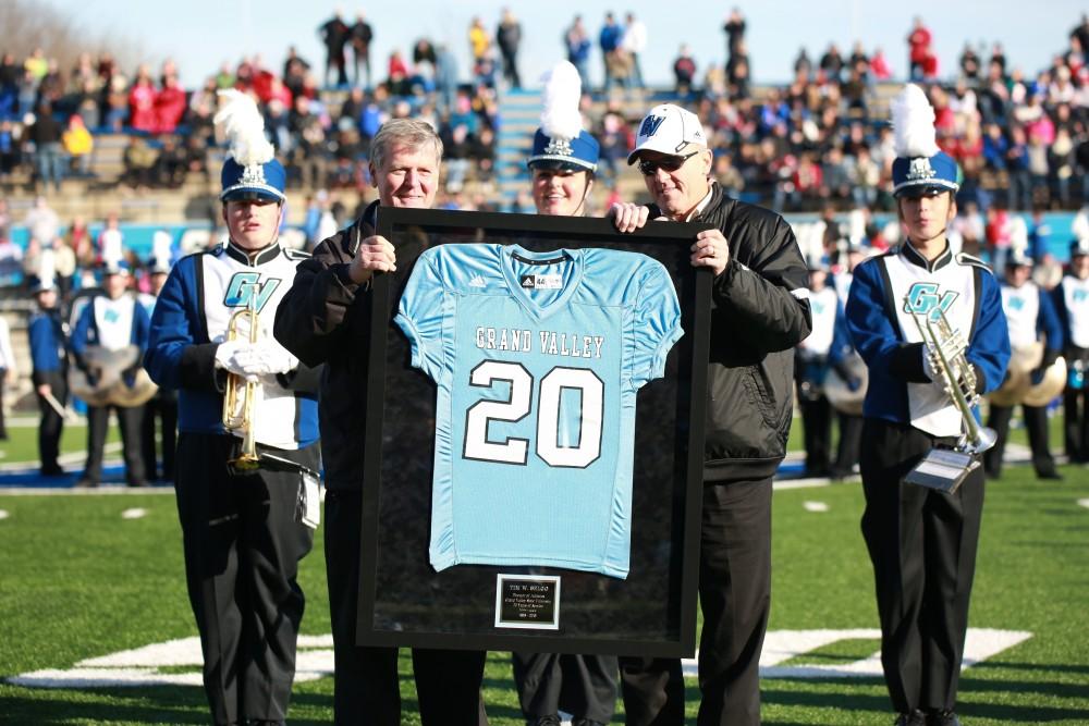 GVL / Kevin Sielaff - The crowd applauds AD Tim Selgo and he is presented with an honorary team jersey.  Grand Valley squares off against SVSU Nov. 14 in Allendale. The Lakers hold on and win with a final score of 24-17.