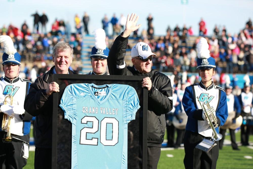 GVL / Kevin Sielaff - The crowd applauds AD Tim Selgo and he is presented with an honorary team jersey.  Grand Valley squares off against SVSU Nov. 14 in Allendale. The Lakers hold on and win with a final score of 24-17.