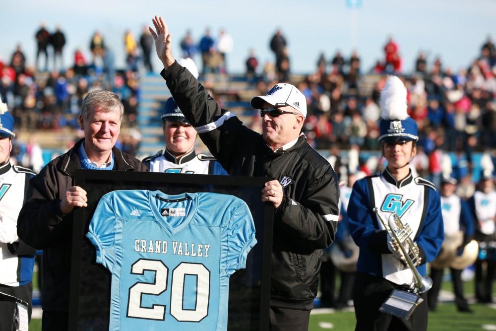 GVL / Kevin Sielaff - The crowd applauds AD Tim Selgo and he is presented with an honorary team jersey.  Grand Valley squares off against SVSU Nov. 14 in Allendale. The Lakers hold on and win with a final score of 24-17.