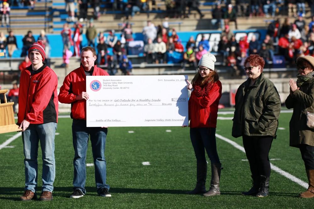 GVL / Kevin Sielaff - The BOTV trophy is presented during halftime.  Grand Valley squares off against SVSU Nov. 14 in Allendale. The Lakers hold on and win with a final score of 24-17.