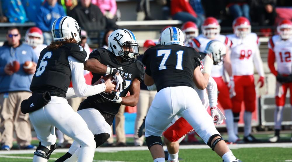 GVL / Kevin Sielaff - Kirk Spencer (27) carries the ball up field.  Grand Valley squares off against SVSU Nov. 14 in Allendale. The Lakers hold on and win with a final score of 24-17.