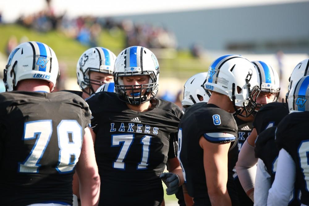 GVL / Kevin Sielaff - Dan DeLuca (71) huddles with his teammates.  Grand Valley squares off against SVSU Nov. 14 in Allendale. The Lakers hold on and win with a final score of 24-17.